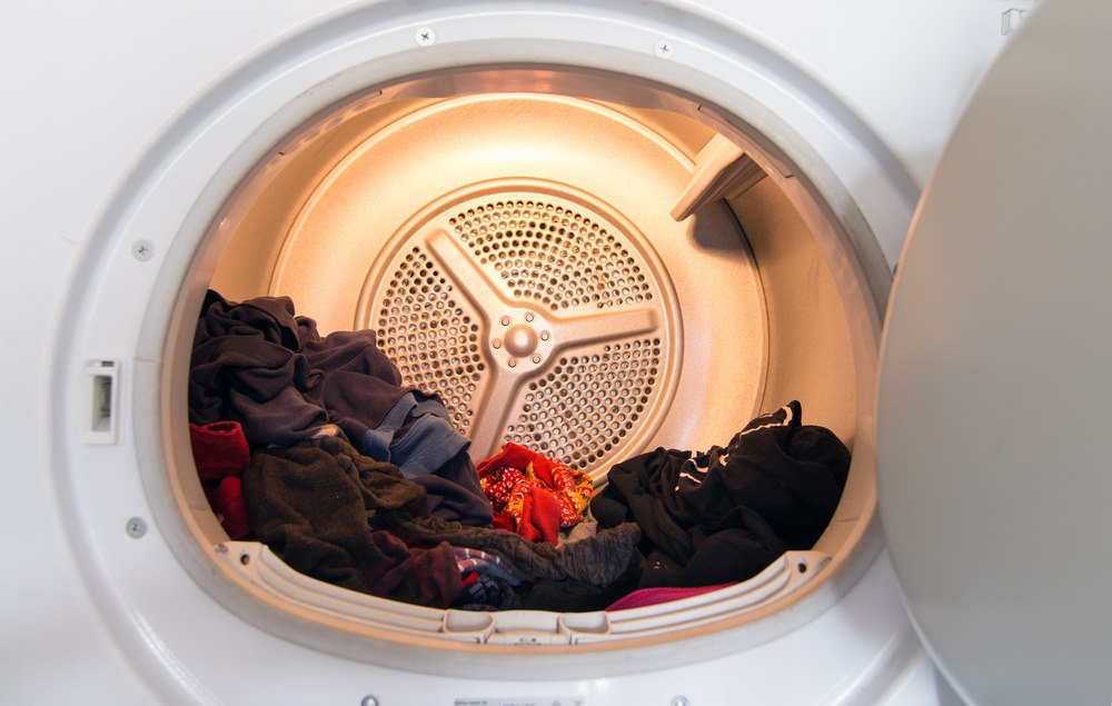 Close-up of a clothes dryer with clothes inside