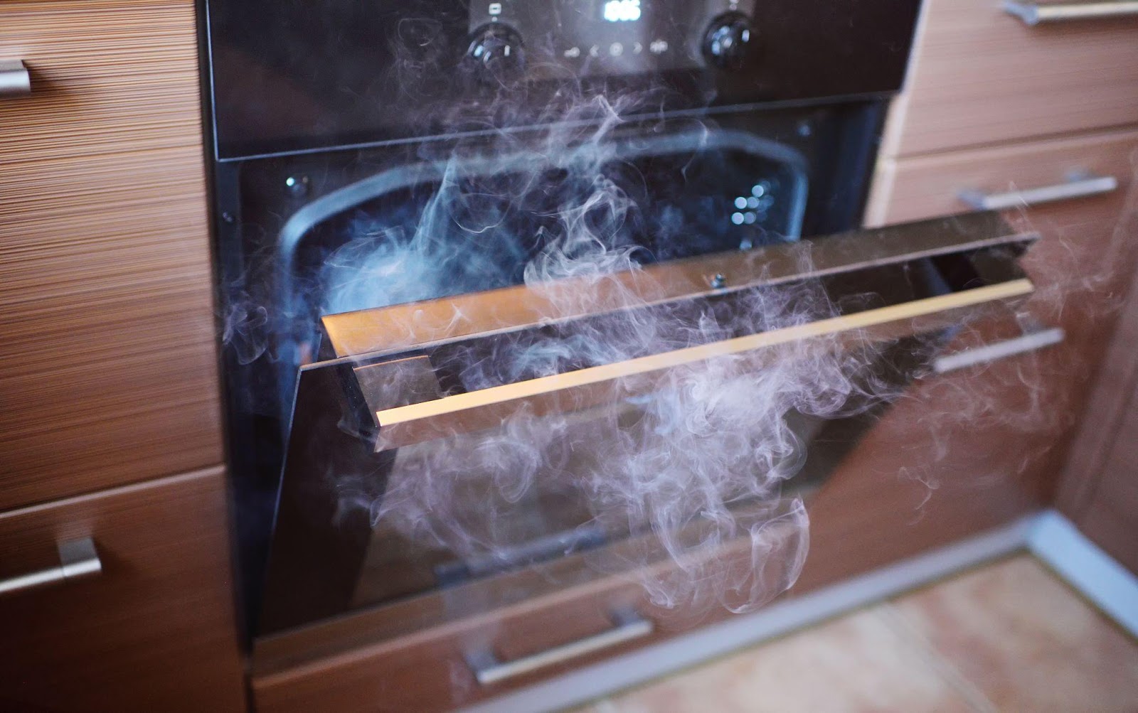 oven with smoke coming out of it