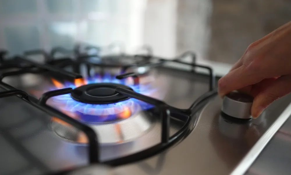 gas stovetop being turned on