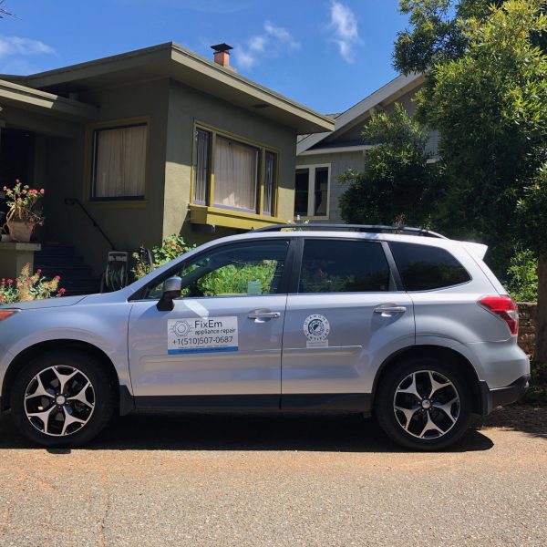 A FixEm technician's car outside of a customer's home