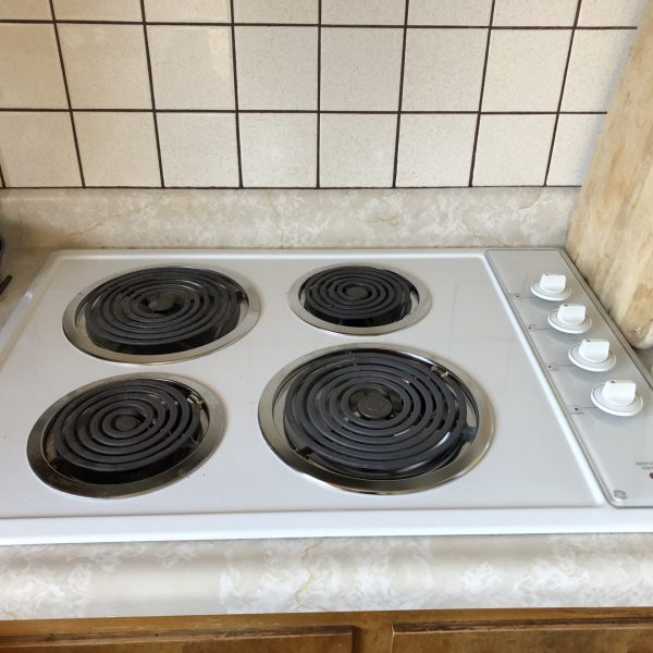 A stovetop in a customer's kitchen.