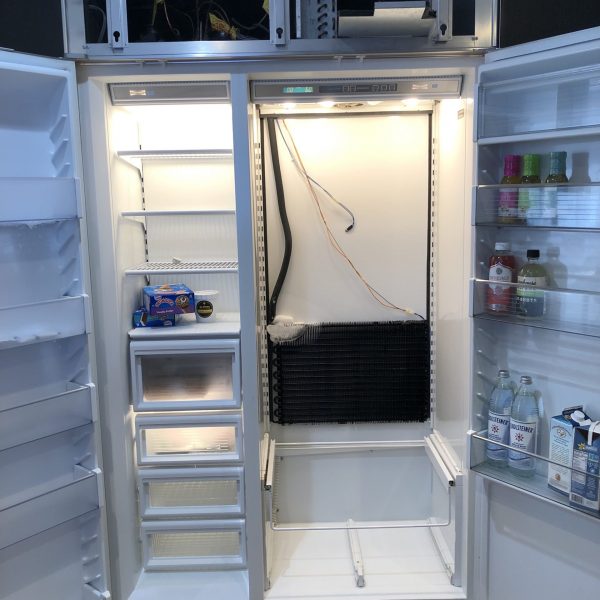 A refrigerator with ice buildup.