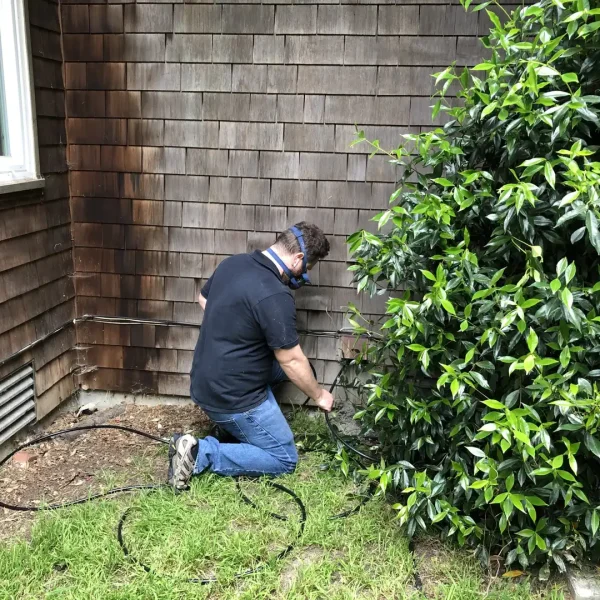 Technician installing outdoor wiring